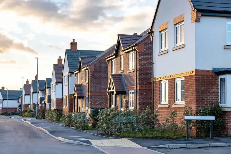 Street of modern brick and rendered homes with tiled roofs